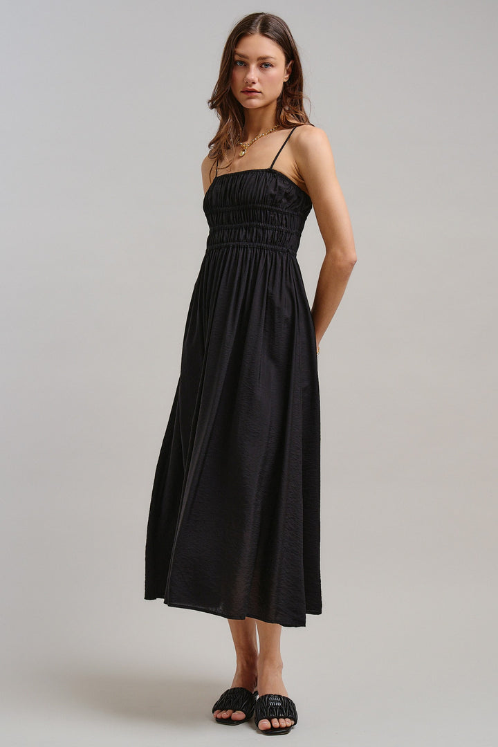 The Drop-Waist Babydoll Midi Dress in Black - Women's Wholesale Dresses | Trend Notes