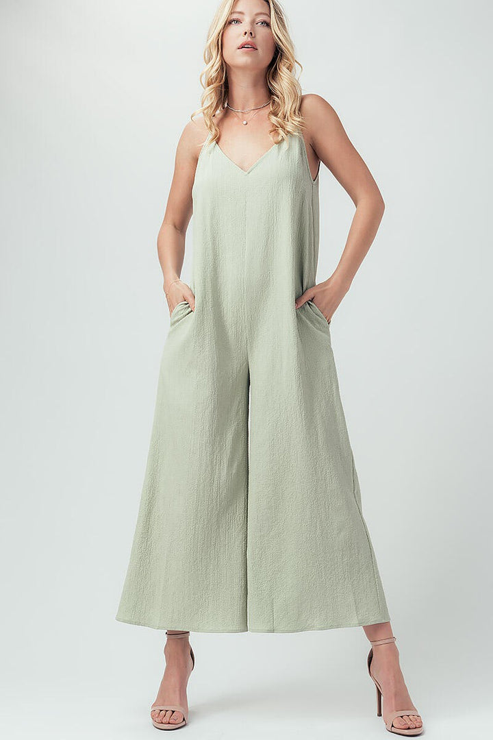 Solid Cami Wide Leg V-Neck Jumpsuit With Pockets in Black - Women's Wholesale Jumpsuits | Trend Notes