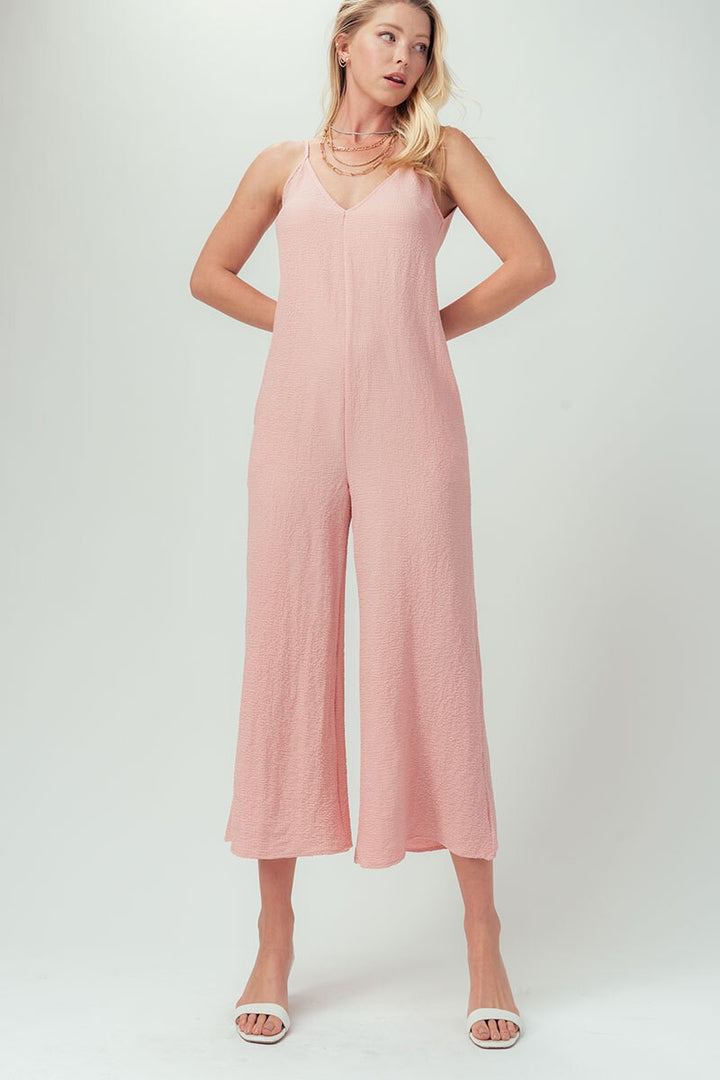 Solid Cami Wide Leg V-Neck Jumpsuit With Pockets in Black - Women's Wholesale Jumpsuits | Trend Notes