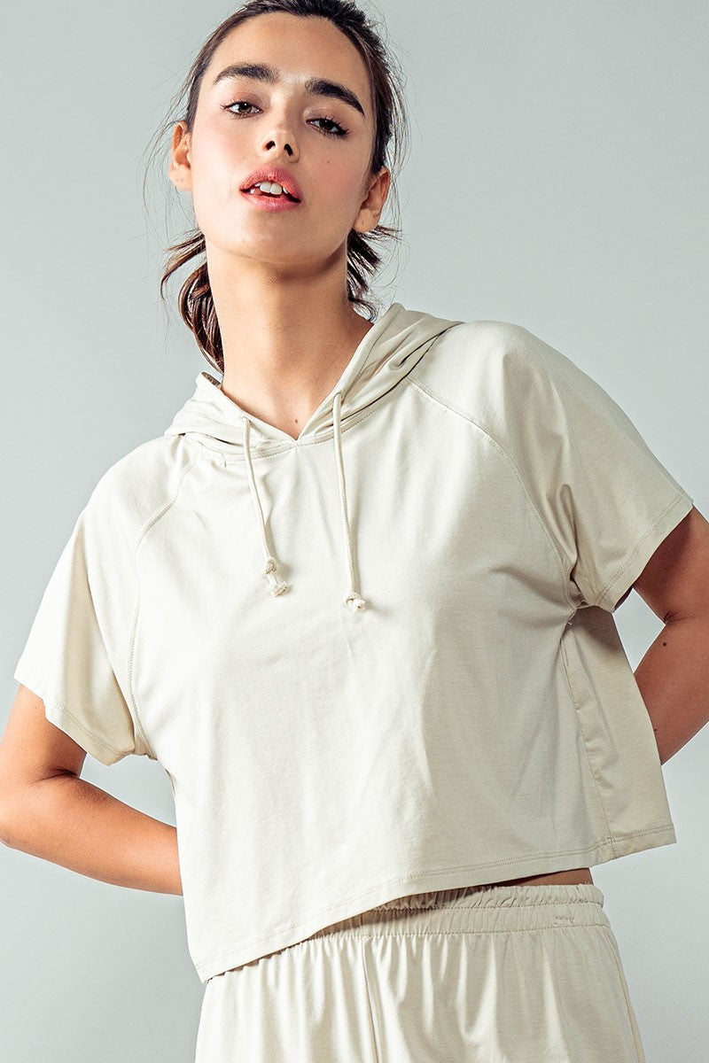 Short Sleeve Cropped Hoodie Top w/Drawstring Hood in Oat Milk - Women's Wholesale Sweatshirts & Hoodies | Trend Notes