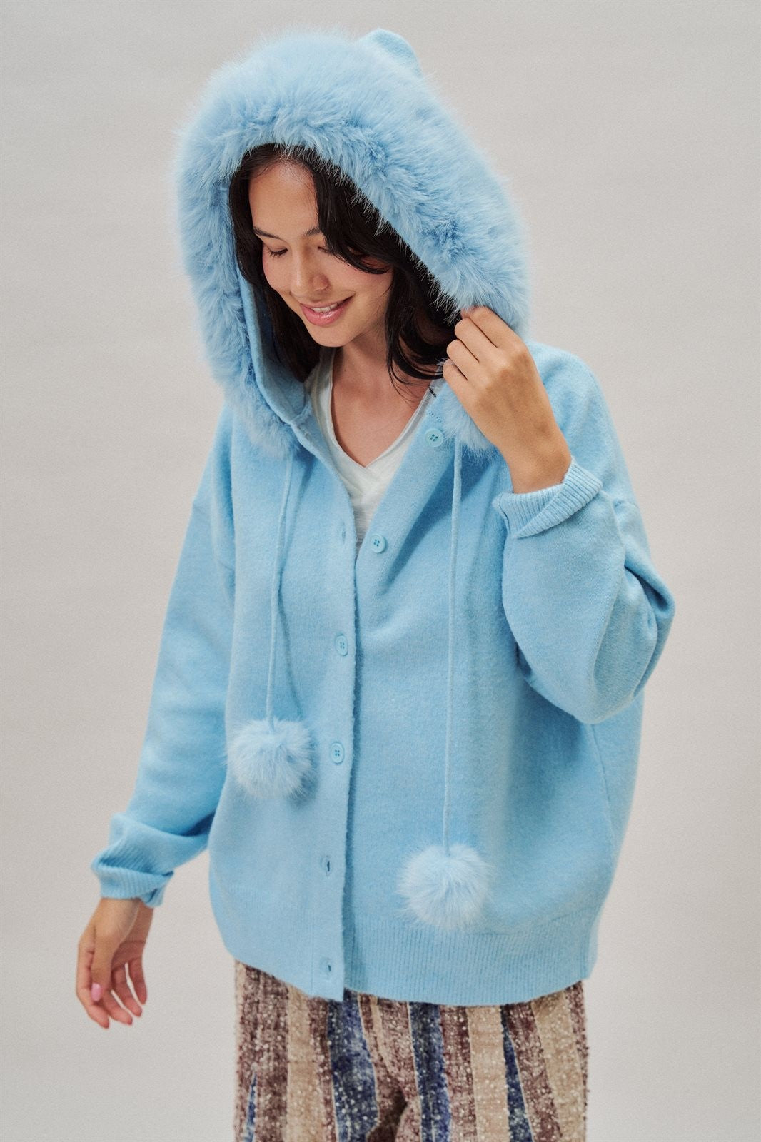 Faux Fur Hood Pom Pom Cardigan Wool Blend in Baby Blue in Blue - Women's Wholesale Cardigans & Shrugs | Trend Notes