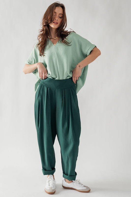 Relaxed Pleated Pants with Wide Waistband in Green - Women's Wholesale Pants | Trend Notes