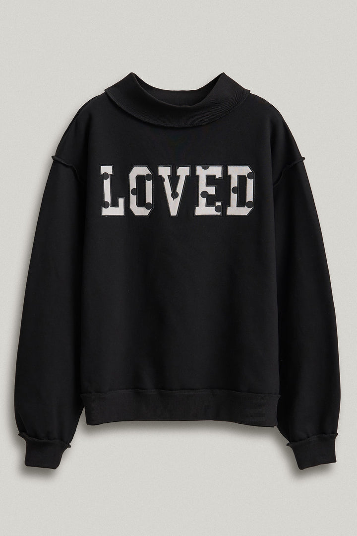 LOVED Varsity Patch Mock Neck Sweatshirt with Exposed Seams in Black - Women's Wholesale Shorts | Trend Notes