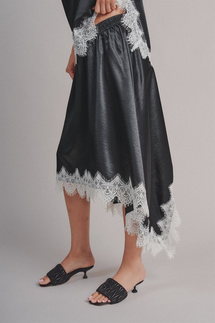Lace Trim Satin Asymmetric Midi Skirt in Black - Women's Wholesale Midi Skirts | Trend Notes