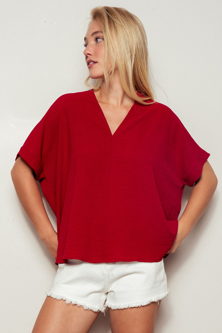 Relaxed V-Neck Folded Casual Top  in Gd Crimson - Women's Wholesale Tops | Trend Notes