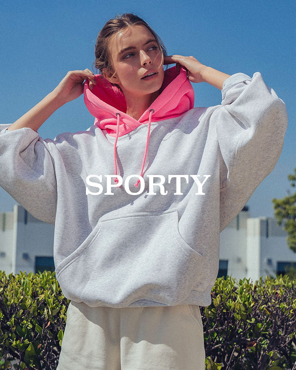 Women’s wholesale sporty hoodie styled in an outdoor lifestyle setting