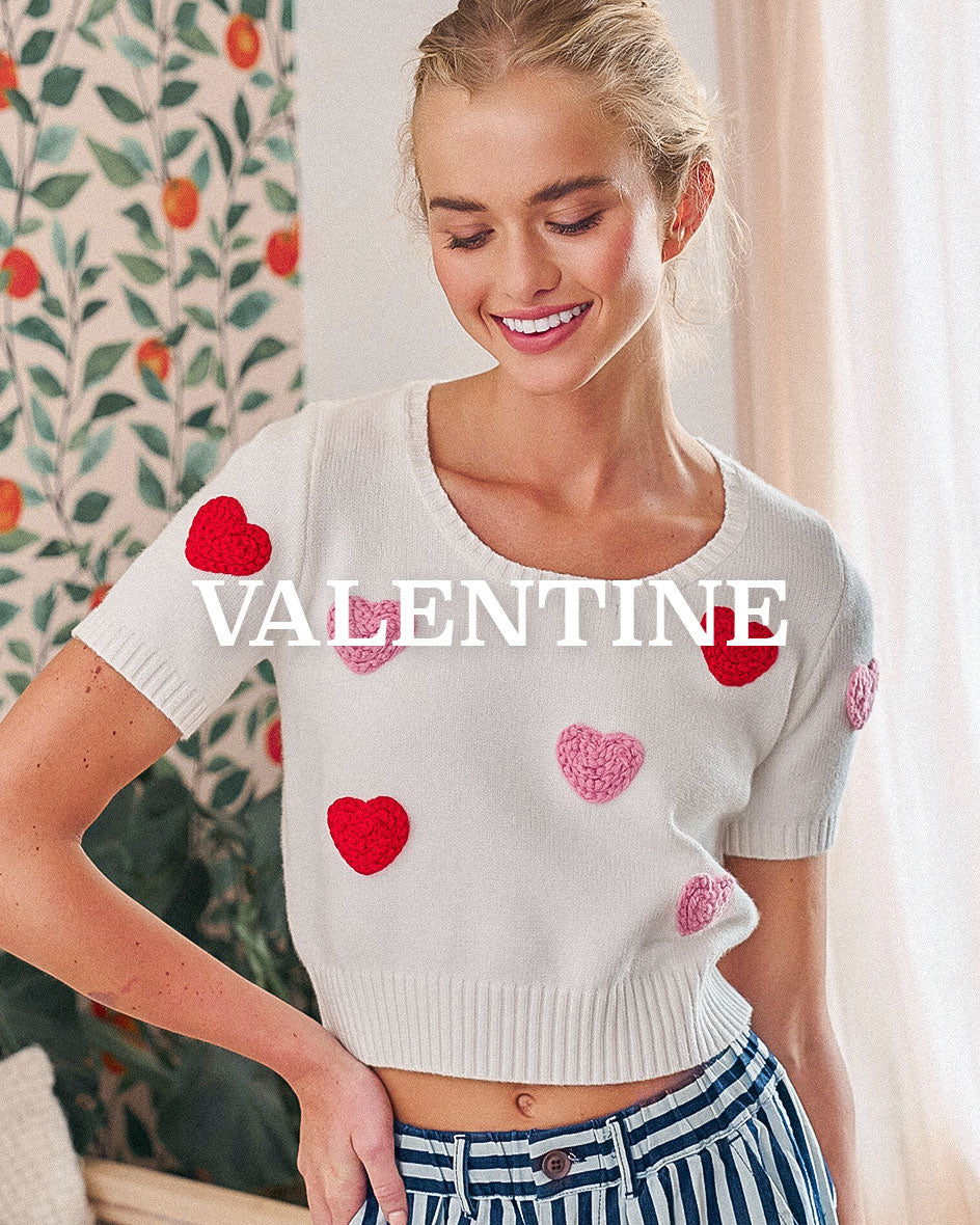Women’s wholesale knit top with heart details styled for Valentine season